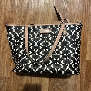 Black and tan Coach handbag